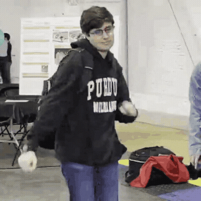 A Young Man Wearing A Black Hoodie That Says " Purdue " On It GIF