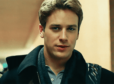 A Young Man Wearing A Black Jacket And A Grey Shirt GIF