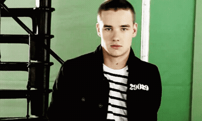 A Young Man Wearing A Black Jacket With The Number 29089 On His Chest GIF