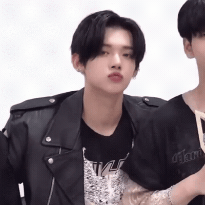 A Young Man Wearing A Black Leather Jacket And A Black T-Shirt GIF