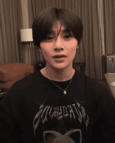 A Young Man Wearing A Black Shirt That Says Eclectic GIF