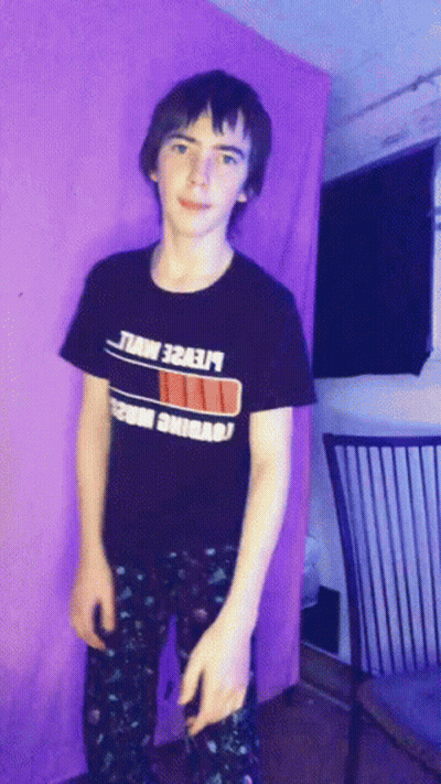 A Young Man Wearing A Black T-Shirt That Says ' Lte2e ' On It GIF