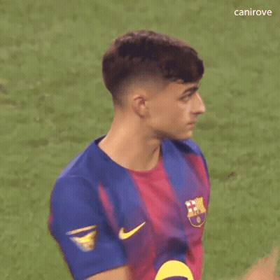 A Young Man Wearing A Blue And Red Nike Jersey Is Standing On A Field . GIF