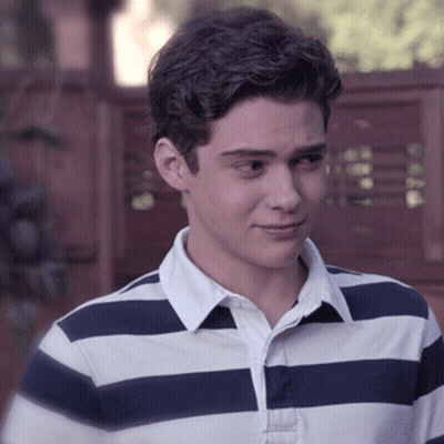 A Young Man Wearing A Blue And White Striped Shirt With A White Collar GIF