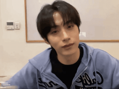 A Young Man Wearing A Blue Hoodie That Says ' Pacifica ' On It GIF