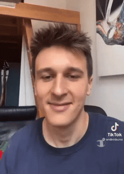 A Young Man Wearing A Blue Shirt That Says Tik Tok GIF