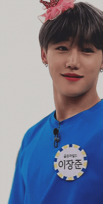 A Young Man Wearing A Blue Shirt With A Name Tag That Says ' 이장준 ' GIF