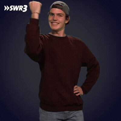 A Young Man Wearing A Brown Sweater And A Baseball Cap Holds His Fist Up In Front Of A Swr3 Logo GIF