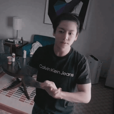 A Young Man Wearing A Calvin Klein Jeans Shirt GIF
