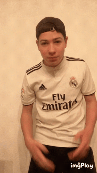A Young Man Wearing A Fly Emirates Jersey And A Hat GIF