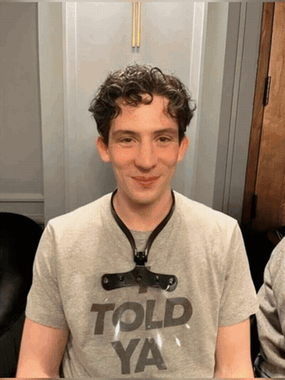 A Young Man Wearing A Gray Shirt That Says Told Ya GIF