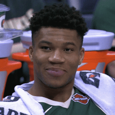 A Young Man Wearing A Green Shirt With The Word Harley Davidson On It Looks At The Camera GIF