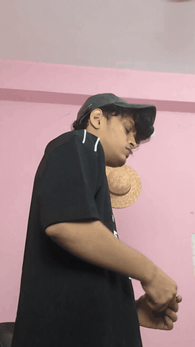 A Young Man Wearing A Hat And A Black Shirt With The Letter N On It GIF