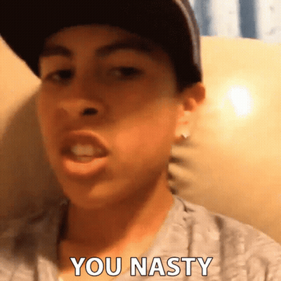 A Young Man Wearing A Hat And A Gray Shirt Says You Nasty GIF