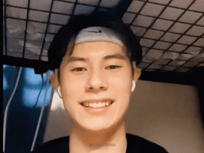 A Young Man Wearing A Headband With The Nike Logo On It GIF