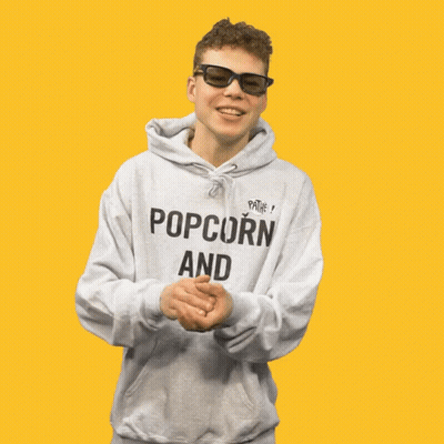 A Young Man Wearing A Hoodie That Says Popcorn And Chill GIF