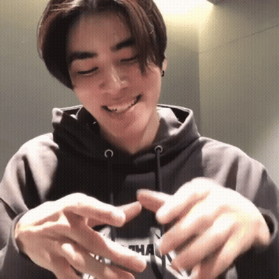 A Young Man Wearing A Hoodie With The Letter N On It GIF