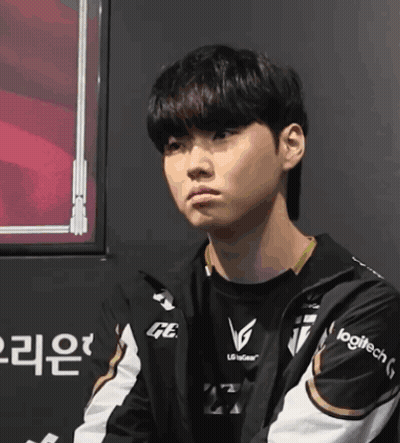 A Young Man Wearing A Jacket That Says Logitech On The Sleeve GIF