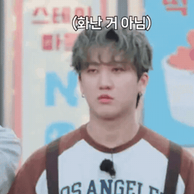 A Young Man Wearing A Los Angeles Shirt And Suspenders Is Making A Sad Face . GIF
