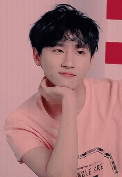 A Young Man Wearing A Pink T-Shirt That Says Comfort Moments Angle Cre GIF