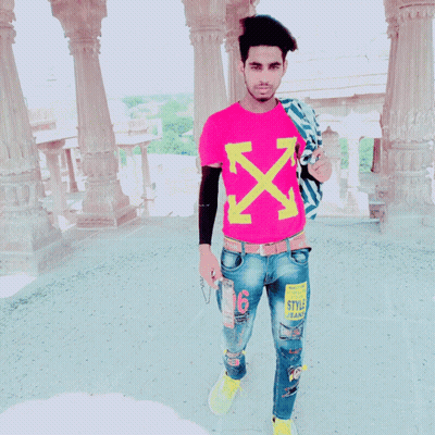 A Young Man Wearing A Pink T-Shirt With Arrows On It GIF
