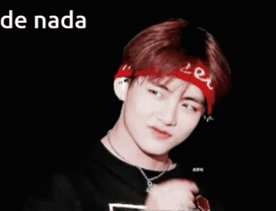 A Young Man Wearing A Red Bandana And A Necklace Is Making A Heart Shape With His Finger GIF