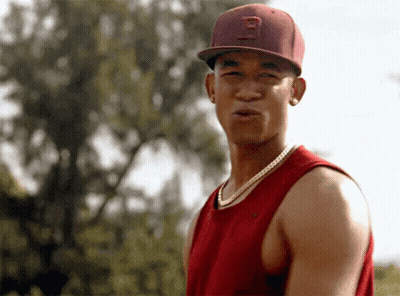 A Young Man Wearing A Red Hat With The Letter B On It GIF
