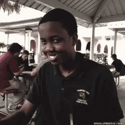 A Young Man Wearing A Shirt That Says ' Champions High School ' On It GIF