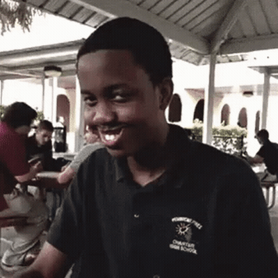 A Young Man Wearing A Shirt That Says Charter High School On It GIF