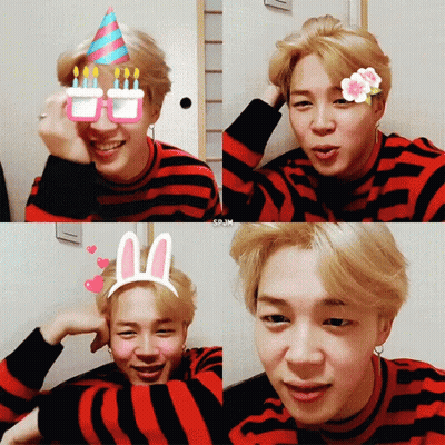 A Young Man Wearing A Striped Shirt And Bunny Ears GIF