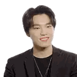 A Young Man Wearing A Suit And A Black Shirt Is Smiling . Sticker