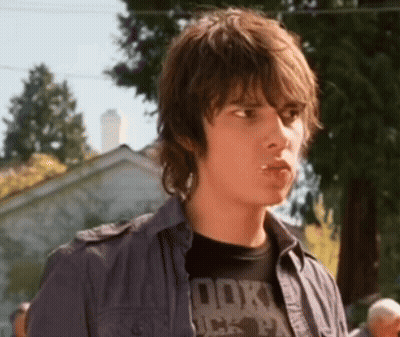 A Young Man Wearing A T-Shirt That Says Rock On It GIF