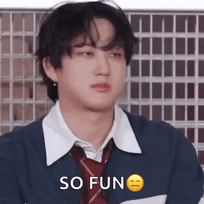 A Young Man Wearing A Tie And A Jacket Is Making A Funny Face And Saying `` So Fun '' . GIF