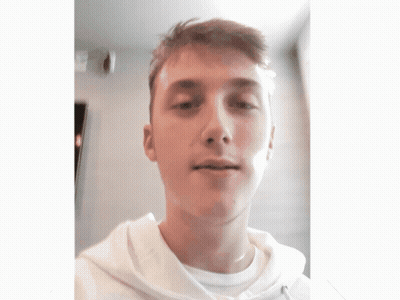A Young Man Wearing A White Shirt And A White Hoodie GIF