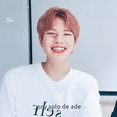 A Young Man Wearing A White Shirt That Says " Soy Solo De Ade " GIF