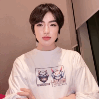 A Young Man Wearing A White T-Shirt With A Picture Of A Cat And A Dog On It GIF