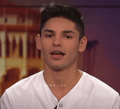 A Young Man Wearing A White T-Shirt With The Word Love On The Front GIF