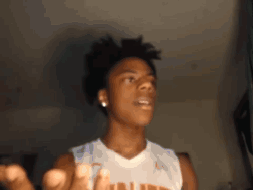 A Young Man Wearing A White Tank Top With The Word Louisiana On It GIF
