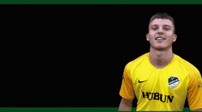 A Young Man Wearing A Yellow Jersey With The Word Hubun On It GIF
