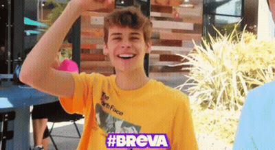 A Young Man Wearing A Yellow Shirt That Says #Breve GIF