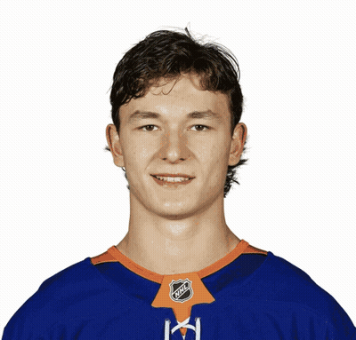A Young Man Wearing An Nhl Jersey Is Smiling GIF
