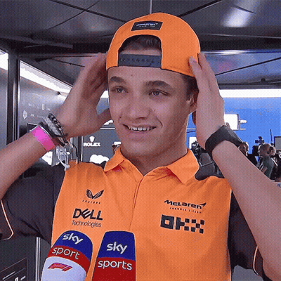 A Young Man Wearing An Orange Shirt That Says Dell Technologies On It GIF