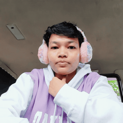 A Young Man Wearing Ear Warmers And A Purple Shirt With The Word Gap On It GIF