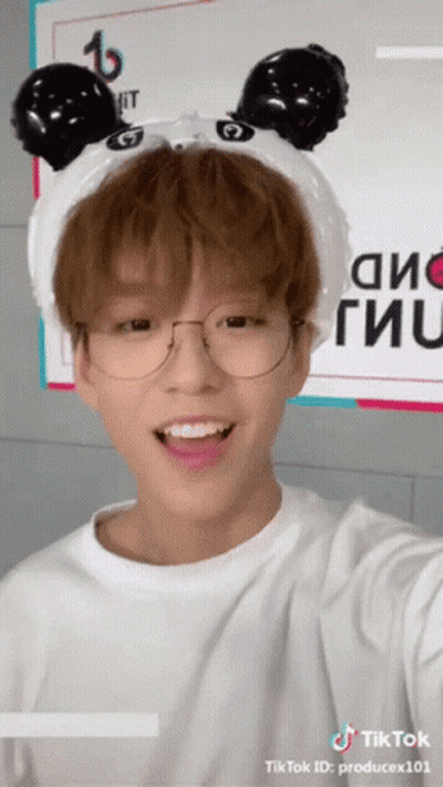 A Young Man Wearing Glasses And A Headband With Panda Ears Has A Tiktok Id Of Producex101 GIF