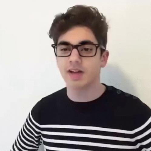 Young Man With Glasses And Striped Shirt GIF
