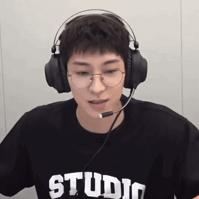A Young Man Wearing Glasses And Headphones With The Word Studio On His T-Shirt GIF