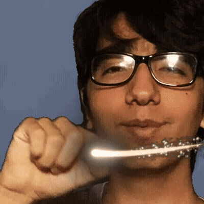 A Young Man Wearing Glasses Is Brushing His Teeth With A Toothbrush GIF