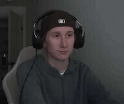 A Young Man Wearing Headphones And A Beanie With The Letter O On It GIF