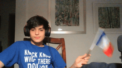 A Young Man Wearing Headphones And A Blue Shirt That Says Knock Know Who There Dolor GIF
