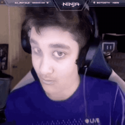 A Young Man Wearing Headphones And A Blue Shirt With The Word Ninja On The Screen . GIF